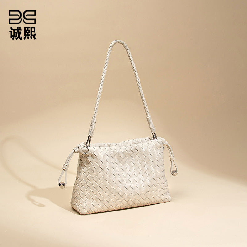 高级感简约单肩腋下女包小众设计垃圾袋斜跨编织包百搭饺子云朵包