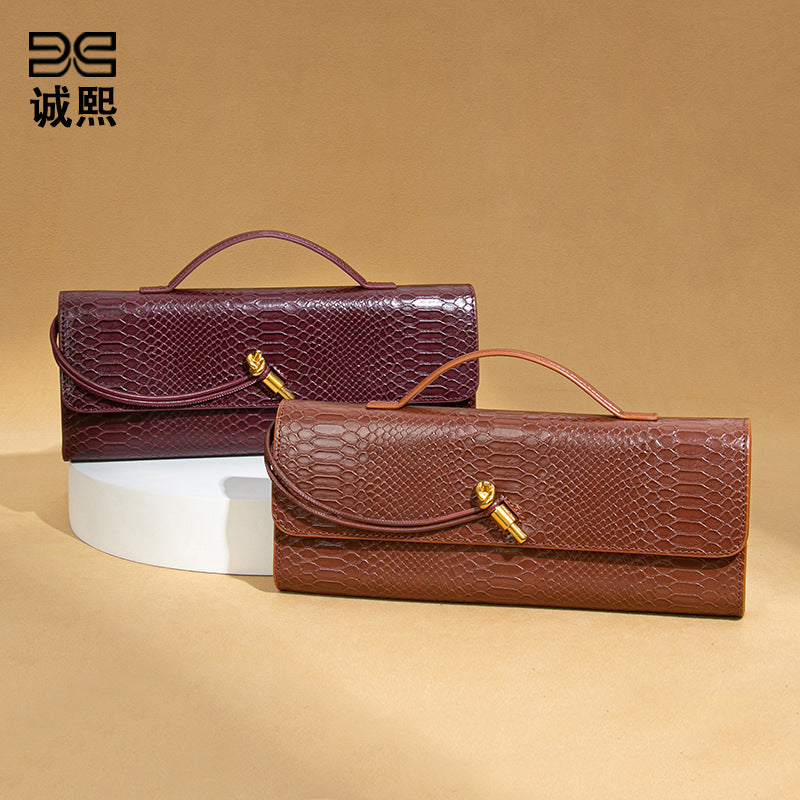 高级感手拿晚宴包包女款横版潮流石头纹法棍包复古小众单肩斜挎包