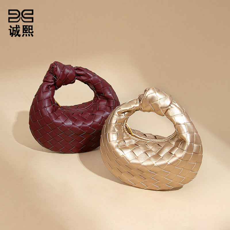 外贸新品时尚手拎饺子包打结手工编织女包百搭mini质感纯色牛角包