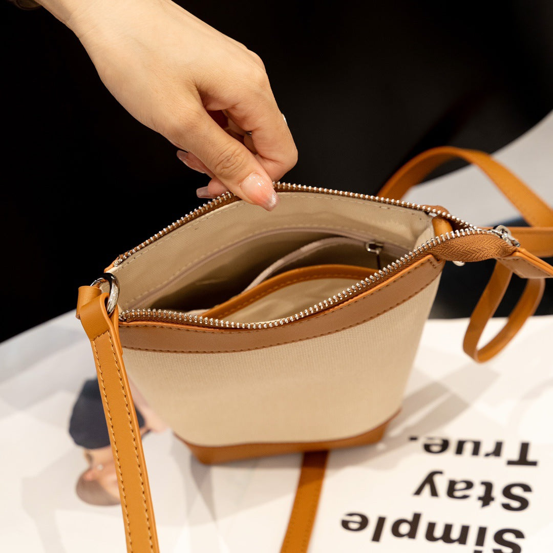 牛皮帆布拼接mini水桶包包女2023夏季单肩斜跨包韩版休闲手机包潮