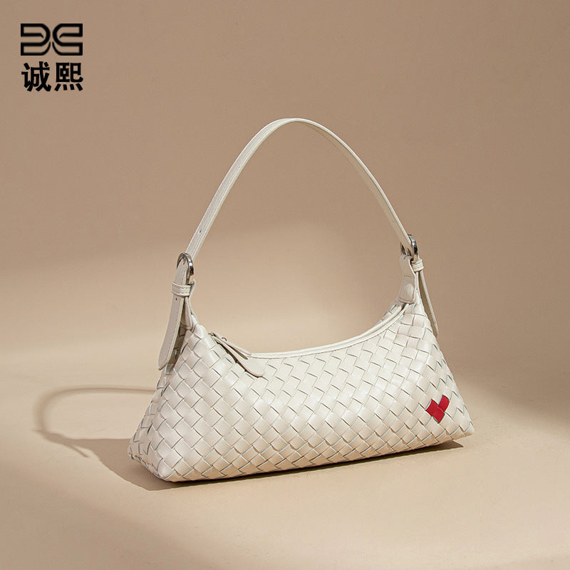 高级感爱心法棍包休闲手提饺子包手工编织女包个性单肩腋下斜跨包