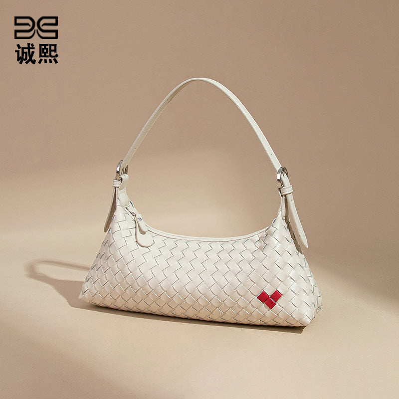 高级感爱心法棍包休闲手提饺子包手工编织女包个性单肩腋下斜跨包