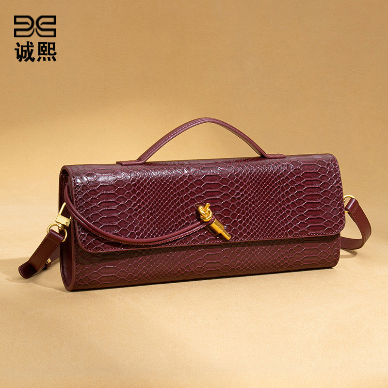 高级感手拿晚宴包包女款横版潮流石头纹法棍包复古小众单肩斜挎包