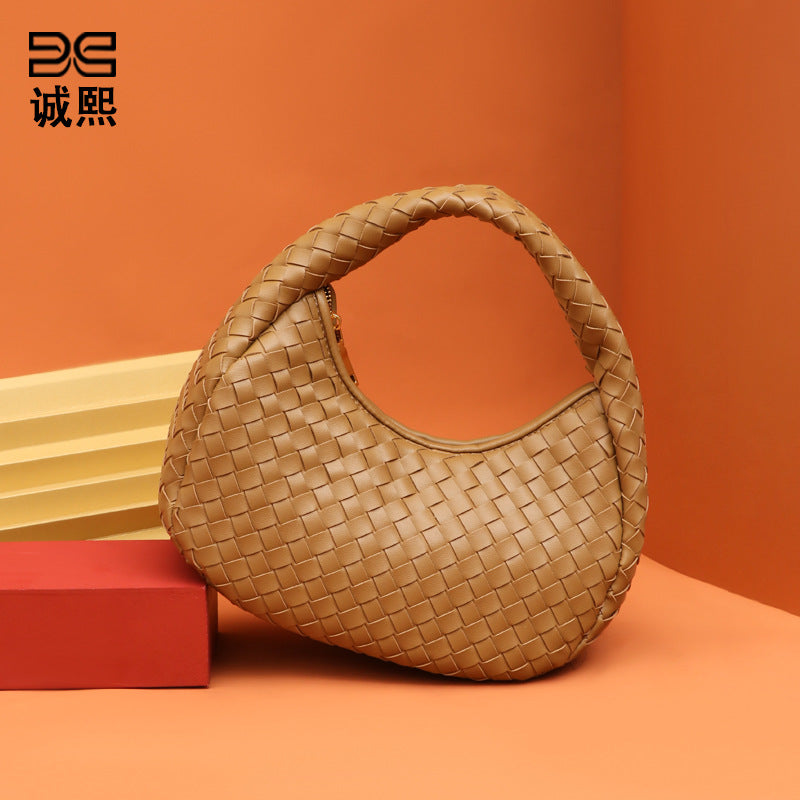 休闲百搭清新手拎月牙包包女网红同款小众简约轻便编织饺子手提包
