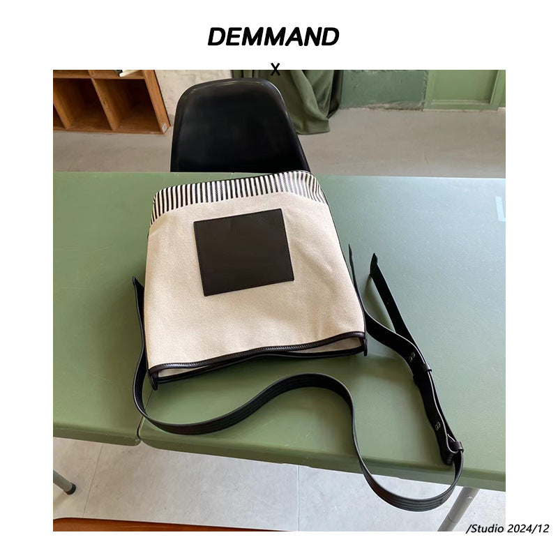 宽肩带水桶包包女士2024新款大容量高级感帆布拼接通勤单肩斜挎包