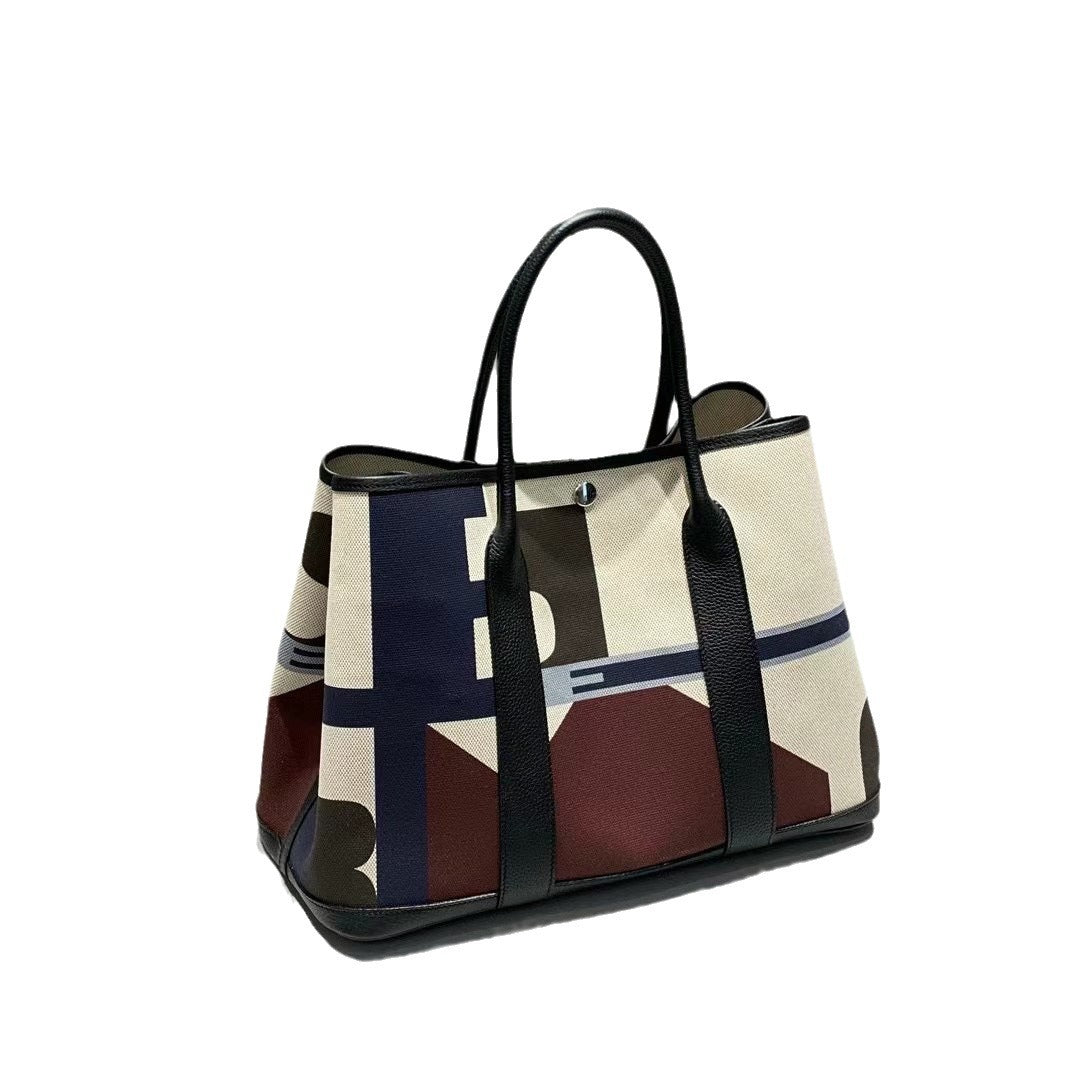 36寸涂鸦彩绘帆布拼接牛皮花园包2024新款大容量托特包单肩手提