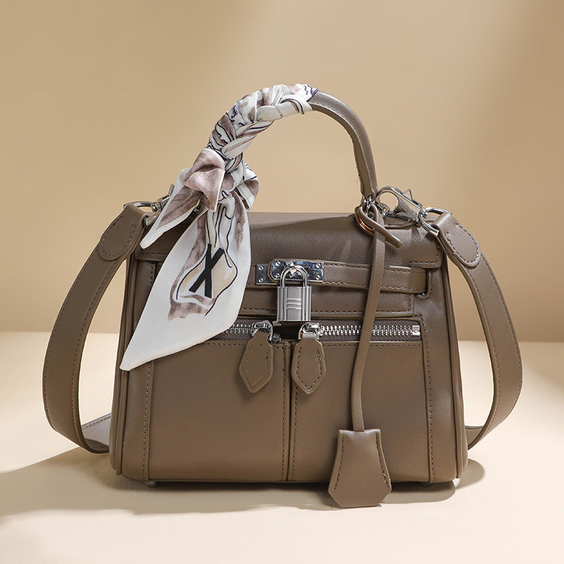 百搭通勤单肩斜挎包宽肩带凯莉包手提包真皮大容量单肩斜挎包女