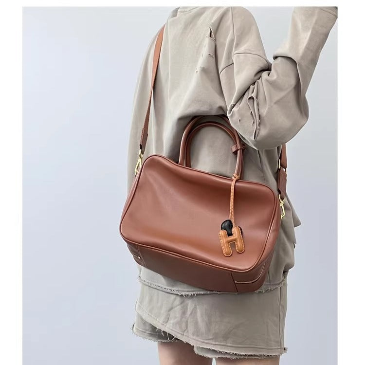 旅行包复古做旧公文包大容量通勤电脑包单肩斜挎真皮保龄球女包