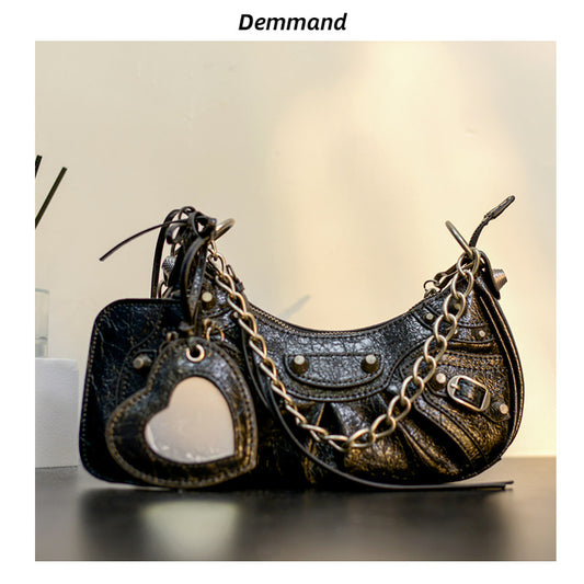 真皮包包女2022新款单肩轻奢月牙包质感法式腋下包铆钉流苏月牙褶