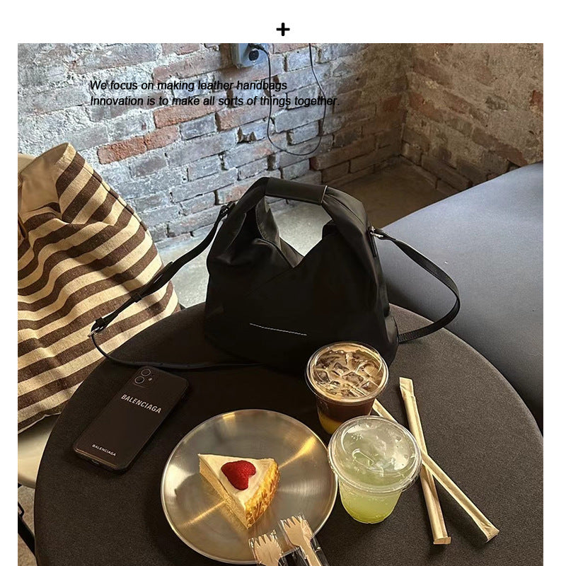 防水牛津布帆布水桶包女高级感小众手提饭盒包真皮斜挎包小托特包