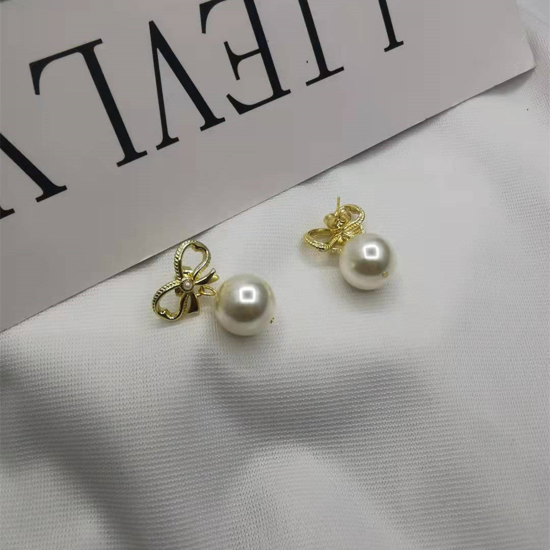赛家21新款蝴蝶结耳钉珍珠耳坠女高级感甜美INS风几何形镀金耳环